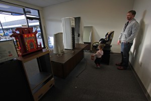 Dr. Jesse Rizor and his daughter, Aurora, at the site of their future pet grooming business at the Mountain View Plaza.