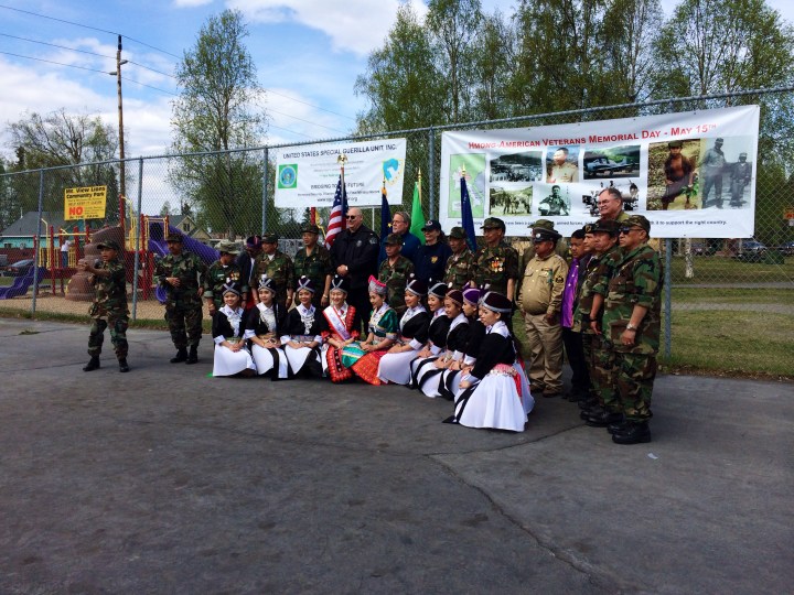 Hmong veterans and dancers pose for a photo at memorial event May 15.